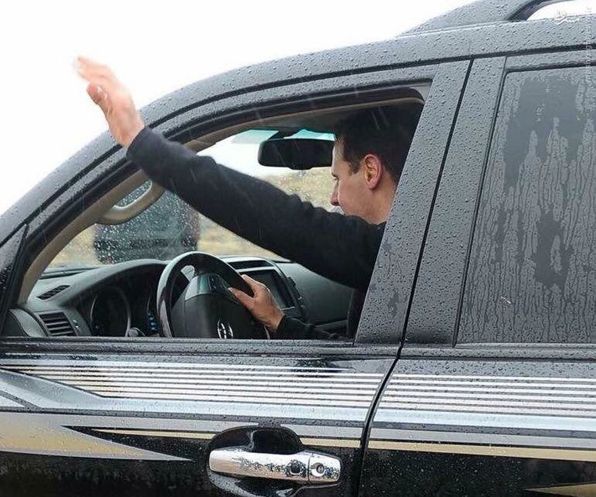 عکس:رانندگی بشار اسد در هوای بارانی دمشق